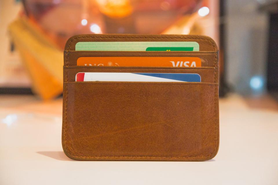 A wallet with credit cards representing PCI compliance.
